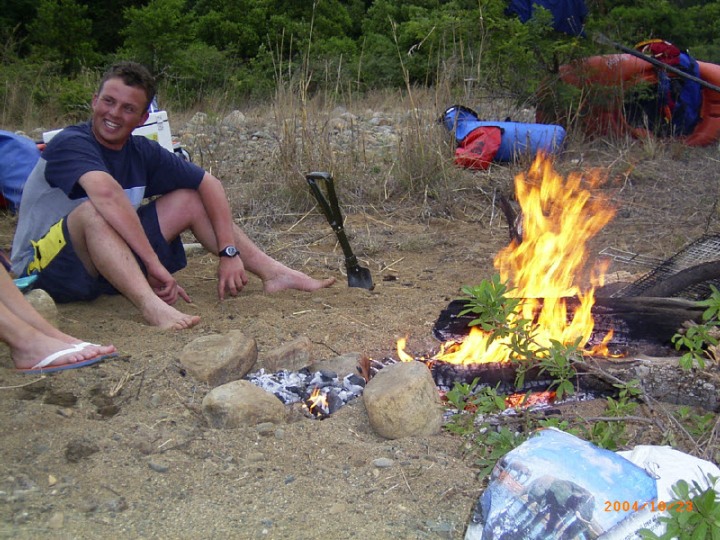 camp fire on a multi-day river rafting trip on the Bivane River - KwaZulu-Natal.